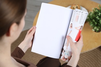 Photo of Woman reading magazine indoors, closeup. Mockup for design
