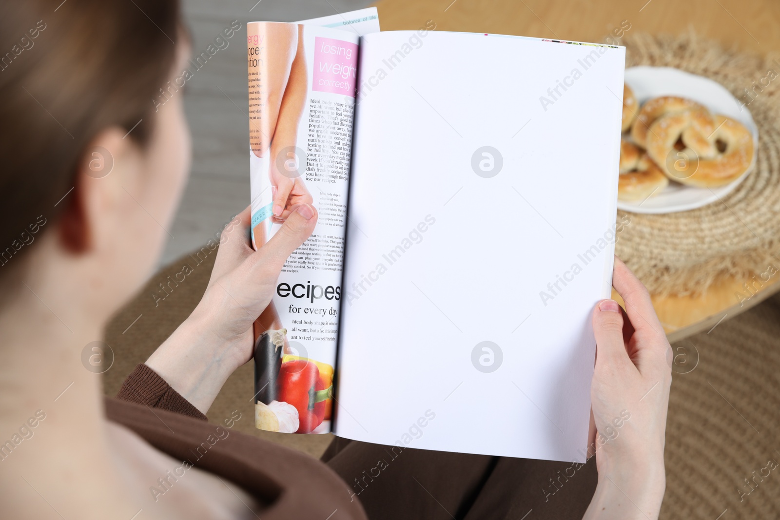 Photo of Woman reading magazine indoors, closeup. Mockup for design