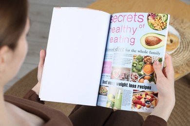 Photo of Woman reading magazine indoors, closeup. Mockup for design