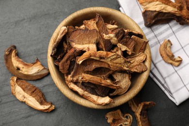 Photo of Dried chanterelle mushrooms on wooden table, flat lay