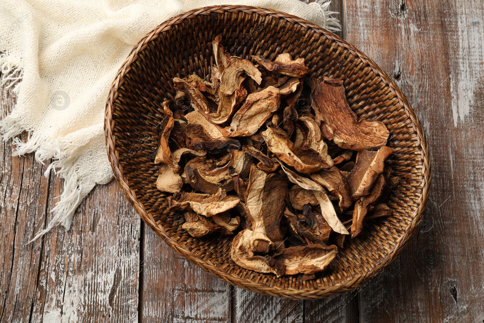 Dried chanterelle mushrooms on wooden table, top view Photo of Dried chanterelle mushrooms on wooden table, top view