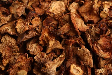 Photo of Many dried chanterelle mushrooms as background, closeup