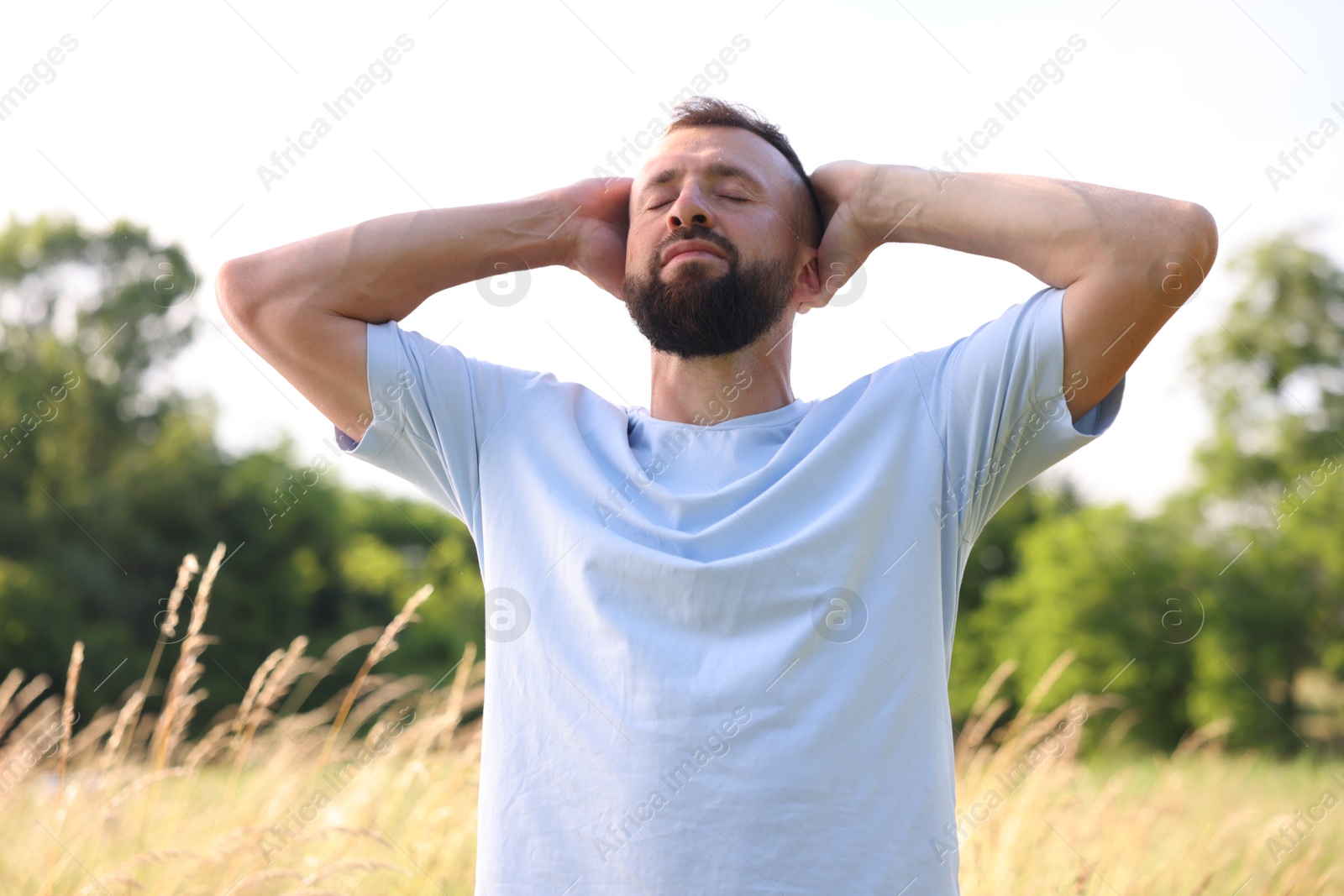Feeling freedom. Happy man enjoying time outdoors Photo of Feeling freedom. Happy man enjoying time outdoors