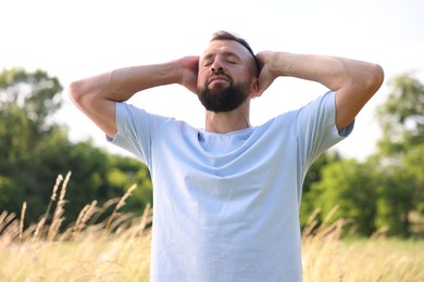 Photo of Feeling freedom. Happy man enjoying time outdoors