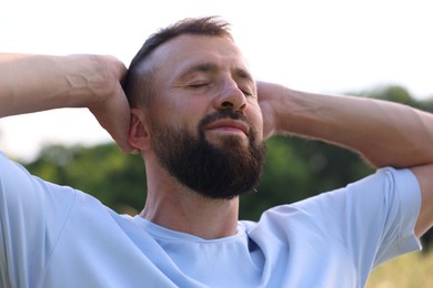 Photo of Feeling freedom. Happy man enjoying time outdoors