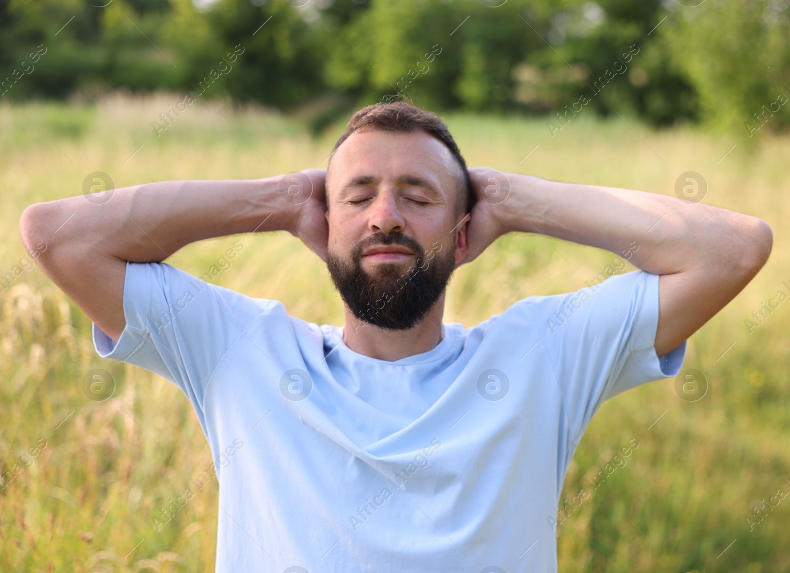 Feeling freedom. Happy man enjoying time outdoors Photo of Feeling freedom. Happy man enjoying time outdoors