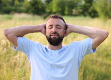 Photo of Feeling freedom. Happy man enjoying time outdoors