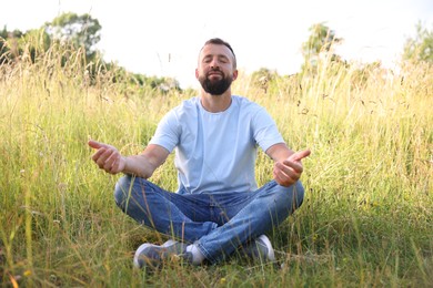 Photo of Feeling freedom. Happy man enjoying time outdoors