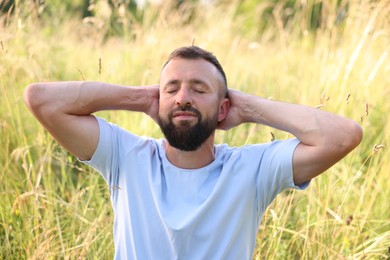 Photo of Feeling freedom. Happy man enjoying time outdoors