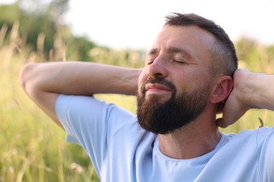 Photo of Feeling freedom. Happy man enjoying time outdoors