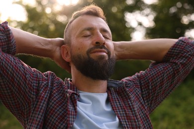 Photo of Feeling freedom. Happy man enjoying time outdoors