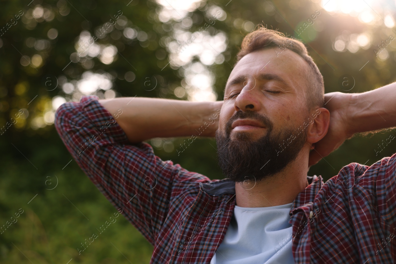 Feeling freedom. Happy man enjoying time outdoors Photo of Feeling freedom. Happy man enjoying time outdoors