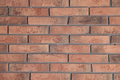 Photo of Texture of red brick wall as background, closeup