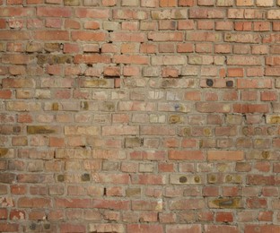 Photo of Texture of old red brick wall as background, closeup