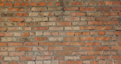 Photo of Texture of red brick wall as background, closeup