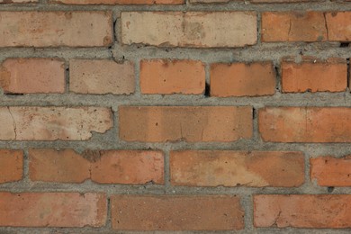 Photo of Texture of red brick wall as background, closeup