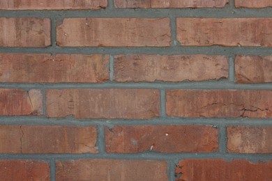 Photo of Texture of red brick wall as background, closeup