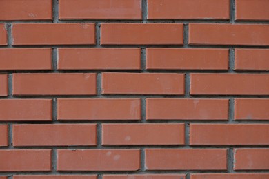 Photo of Texture of red brick wall as background, closeup