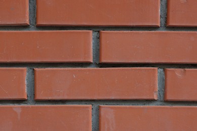 Photo of Texture of red brick wall as background, closeup