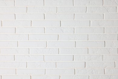 Photo of Texture of white brick wall as background, closeup