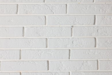 Photo of Texture of white brick wall as background, closeup
