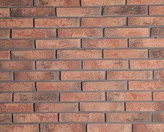 Photo of Texture of red brick wall as background, closeup