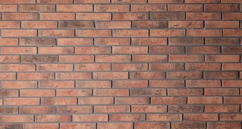 Photo of Texture of red brick wall as background, closeup
