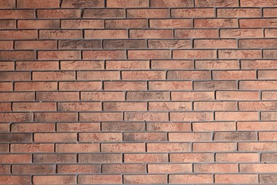 Photo of Texture of red brick wall as background, closeup