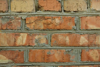 Photo of Texture of old red brick wall as background, closeup
