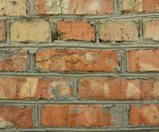 Photo of Texture of old red brick wall as background, closeup