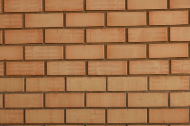 Photo of Texture of red brick wall as background, closeup