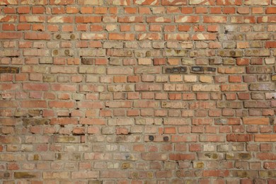 Photo of Texture of old red brick wall as background, closeup