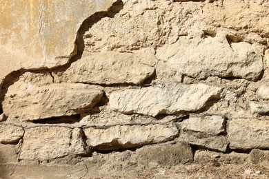 Photo of Texture of old stone wall as background, closeup
