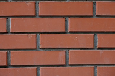 Photo of Texture of red brick wall as background, closeup