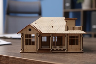 Photo of House model on desk in real estate agent's office, closeup