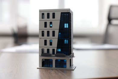 Photo of House model on desk in real estate agent's office, closeup