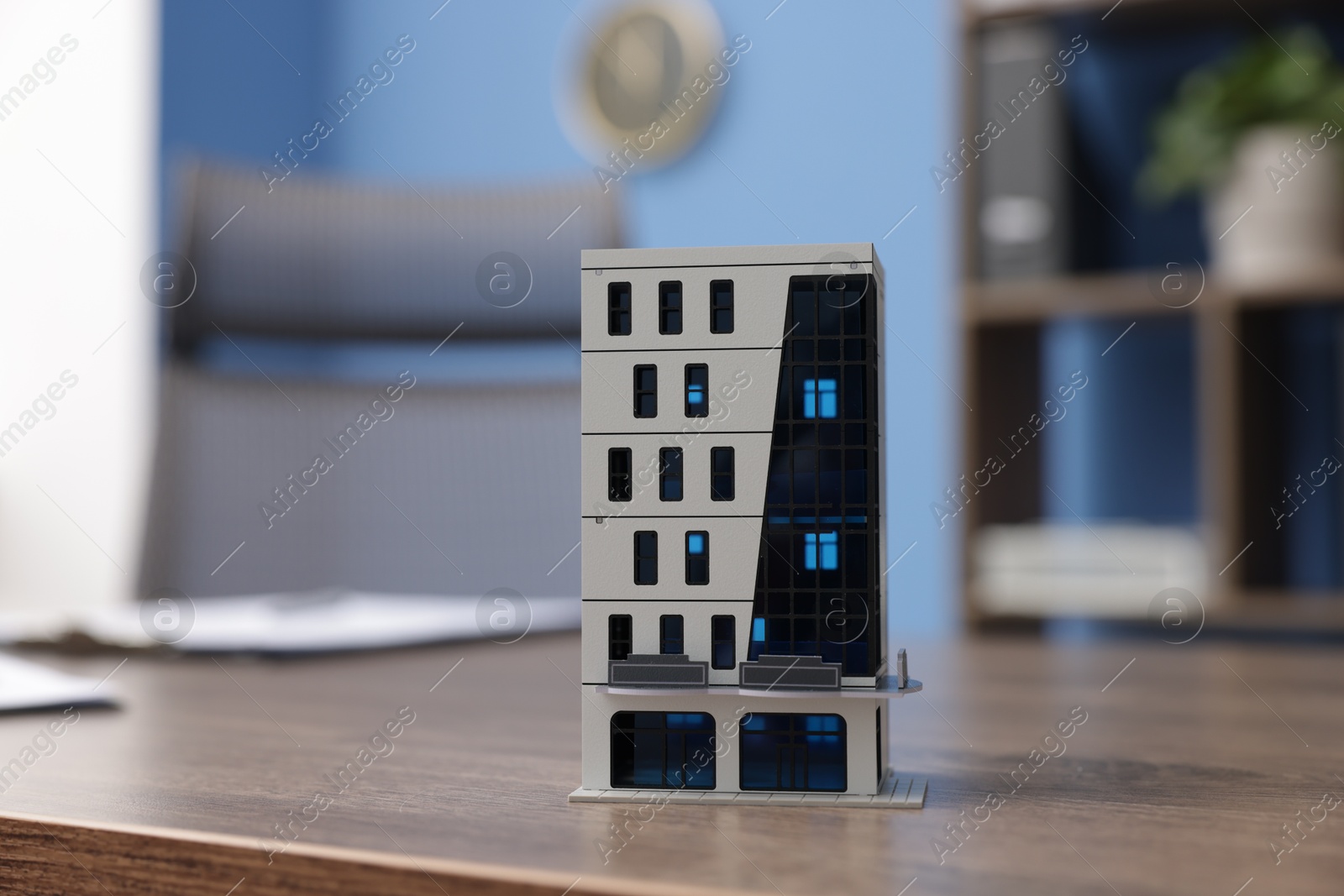 House model on desk in real estate agent's office, closeup Photo of House model on desk in real estate agent's office, closeup