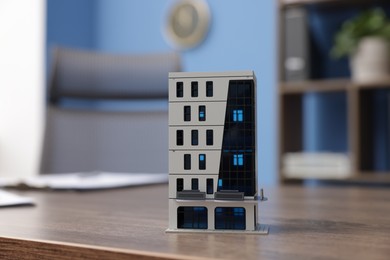 Photo of House model on desk in real estate agent's office, closeup