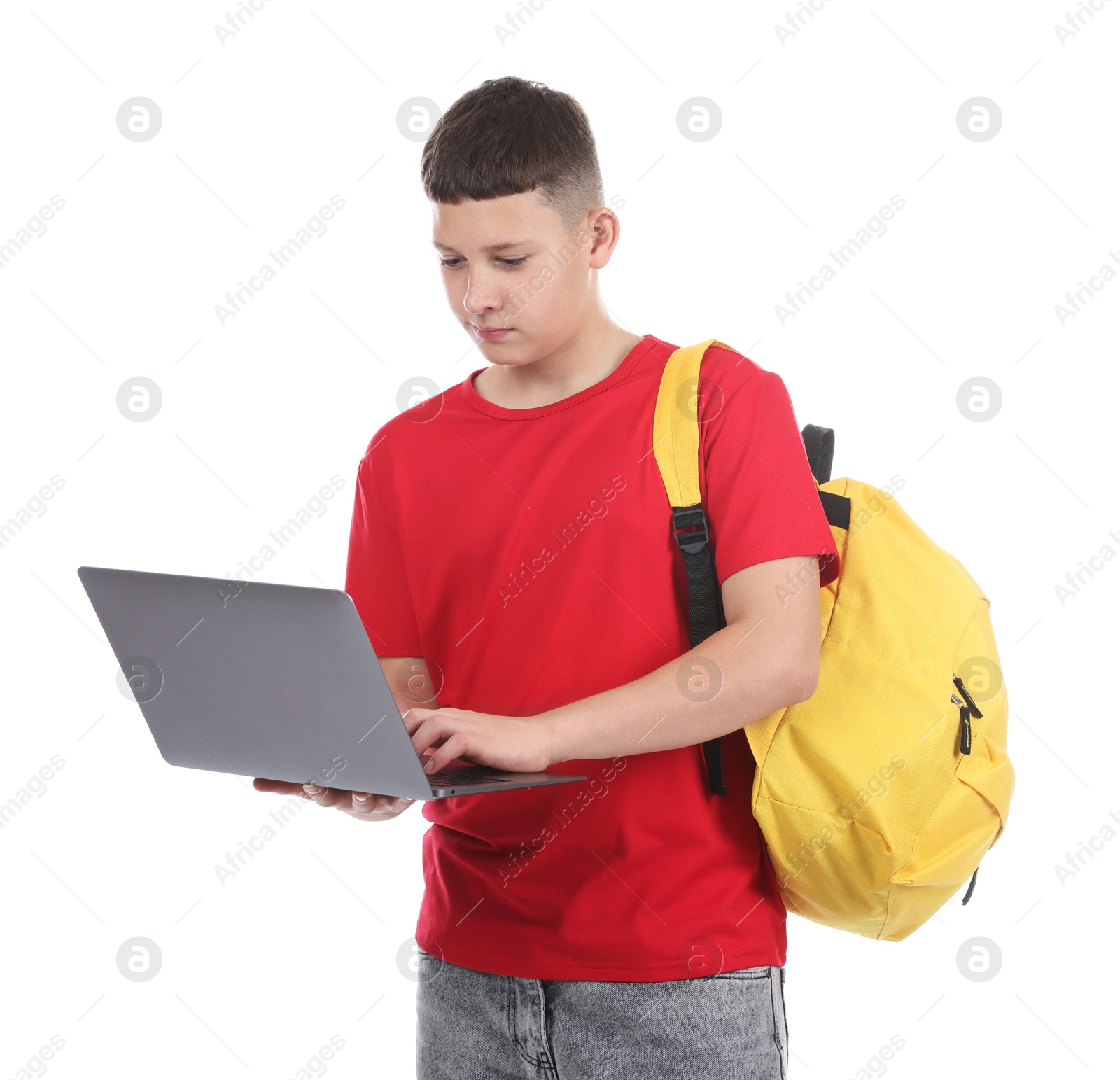 Photo of Teenage boy with laptop and backpack on white background