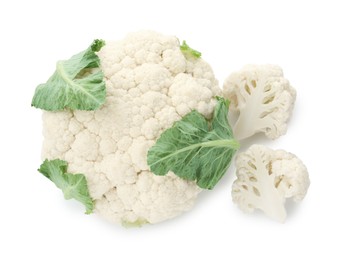 Photo of One fresh cauliflower head and pieces of florets isolated on white, top view
