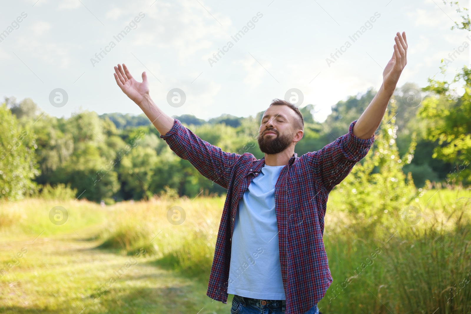 Photo of Feeling freedom. Man enjoying time outdoors. Space for text