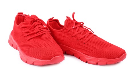 Photo of Pair of stylish red sneakers on white background