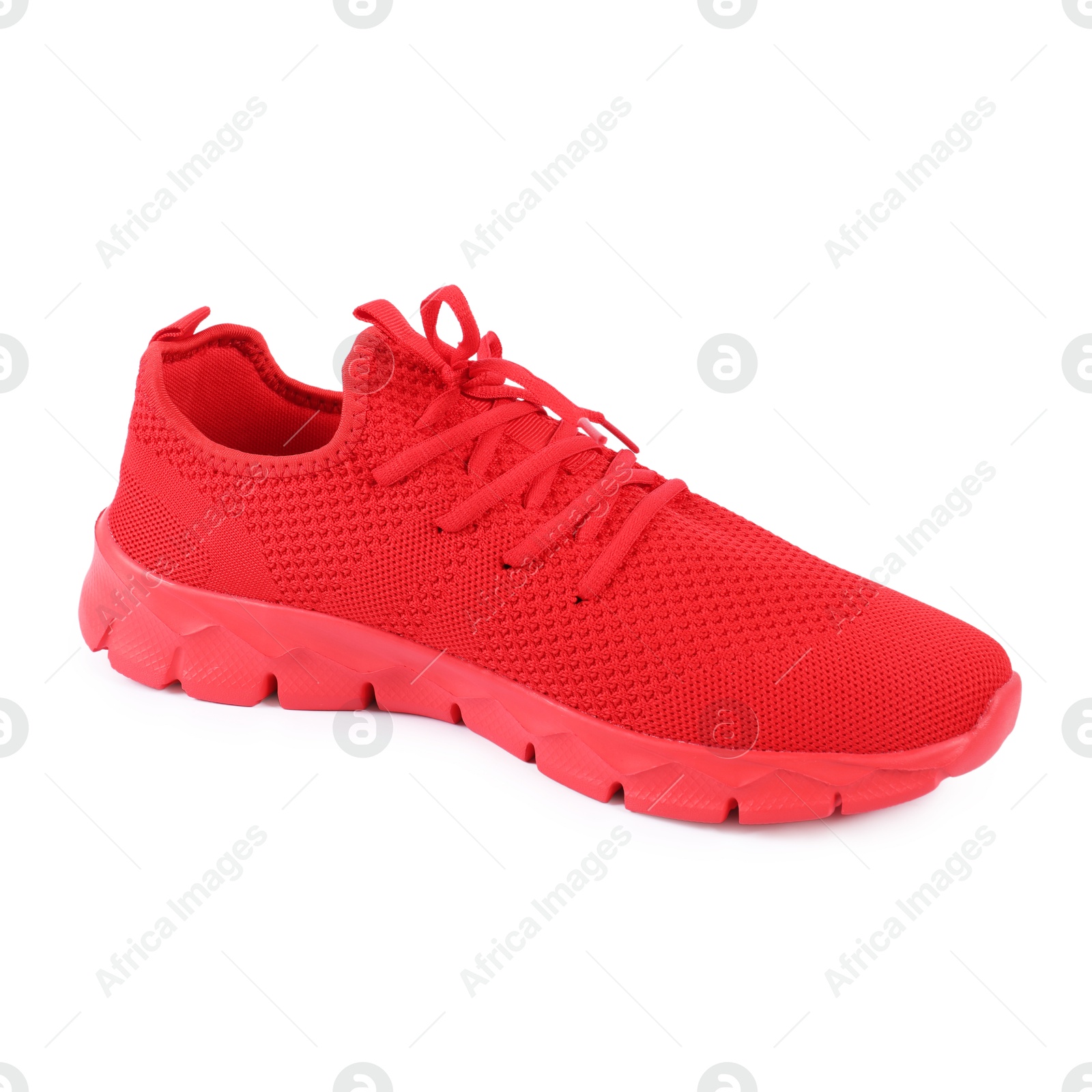 One stylish red sneaker on white background Photo of One stylish red sneaker on white background