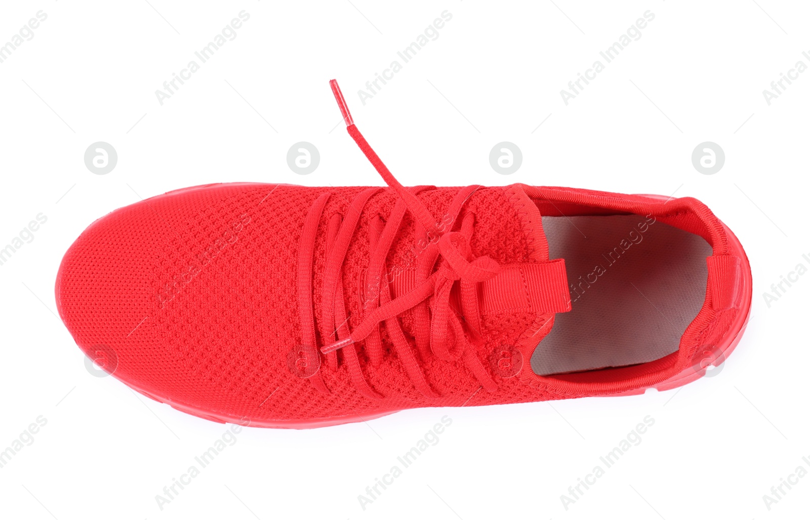 Photo of One stylish red sneaker on white background, top view