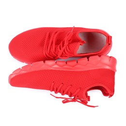 Photo of Pair of stylish red sneakers on white background, top view