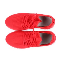 Photo of Pair of stylish red sneakers on white background, top view