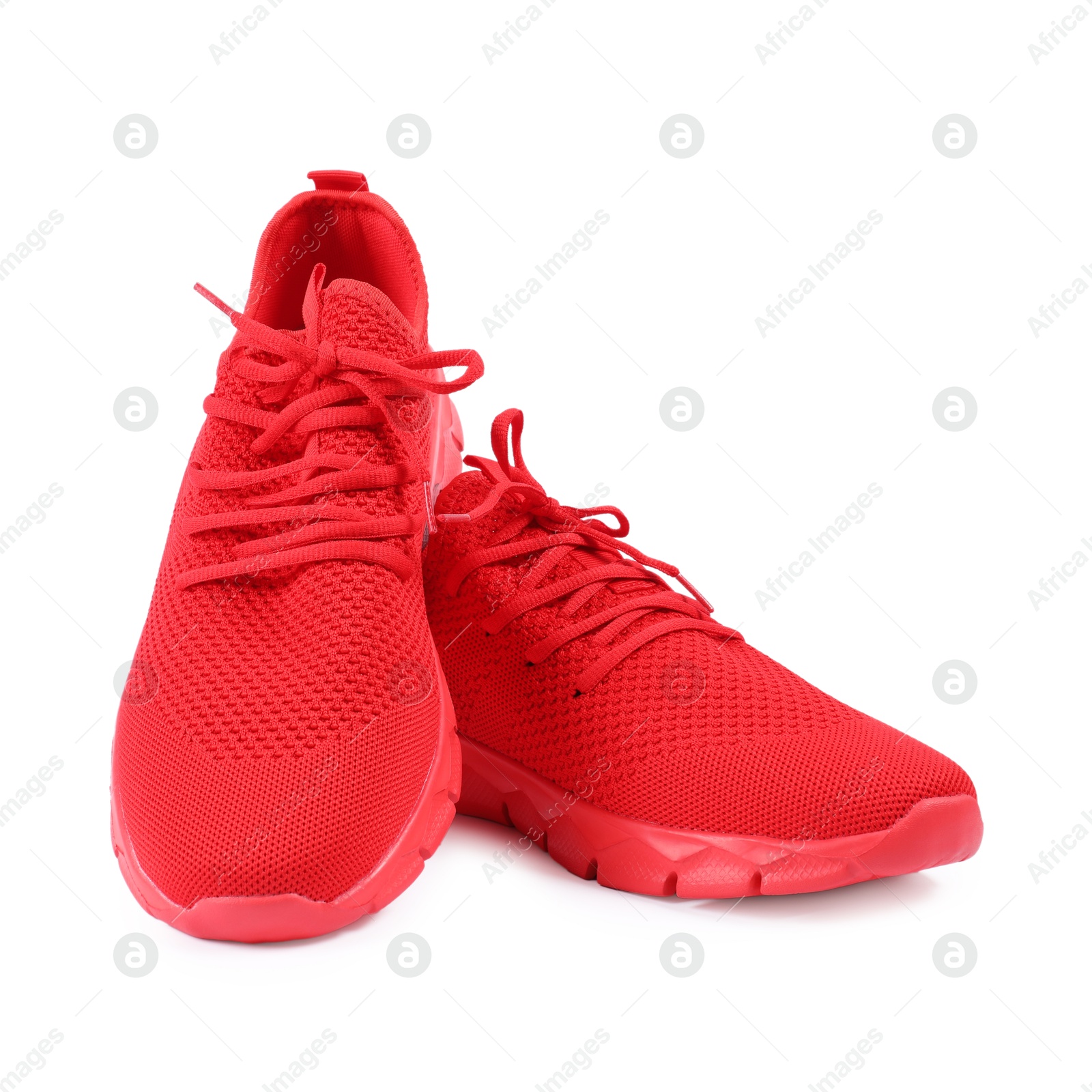Photo of Pair of stylish red sneakers on white background