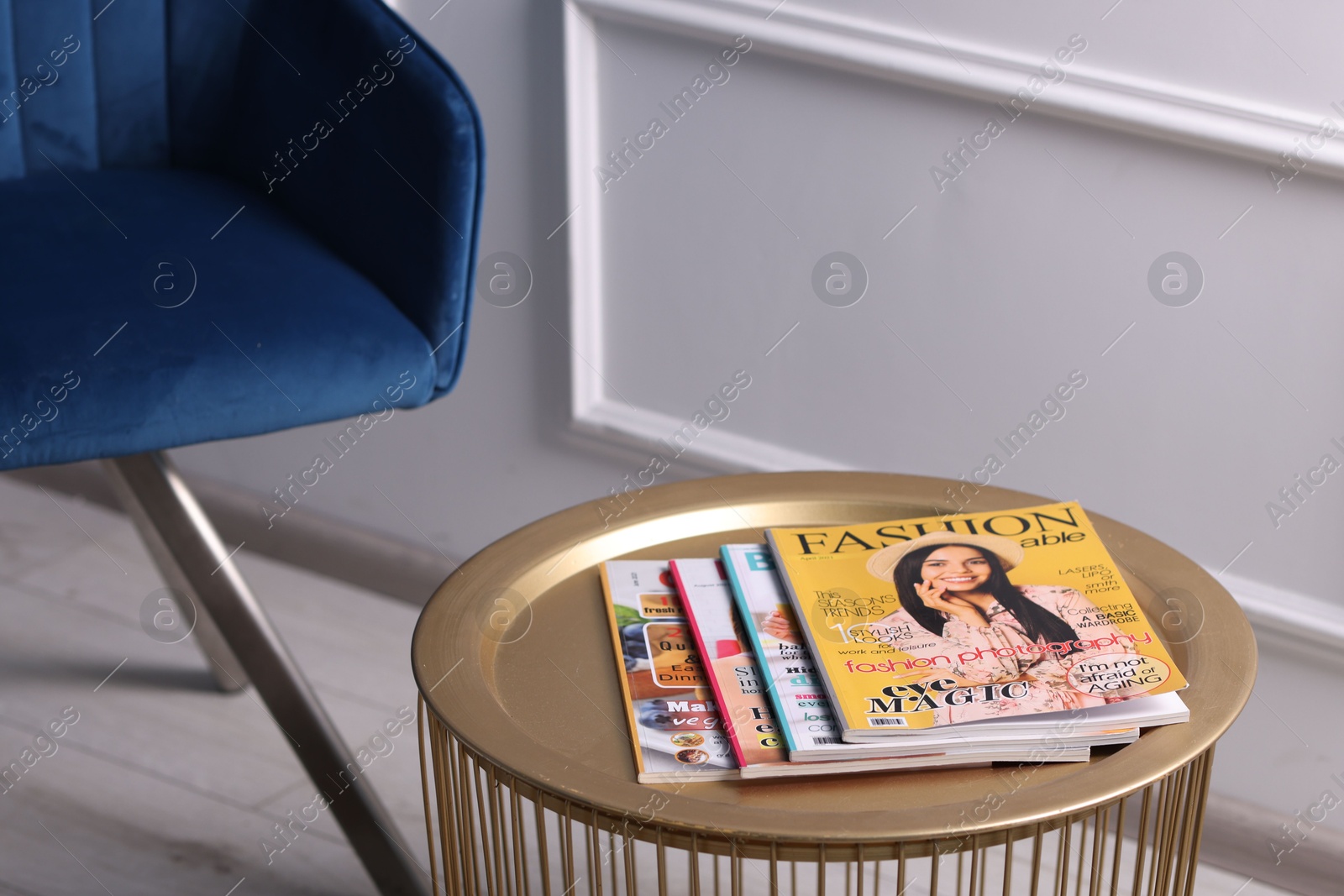 Many different trendy magazines on table indoors, closeup Photo of Many different trendy magazines on table indoors, closeup