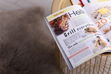 Photo of Open trendy magazine on table indoors, above view. Space for text