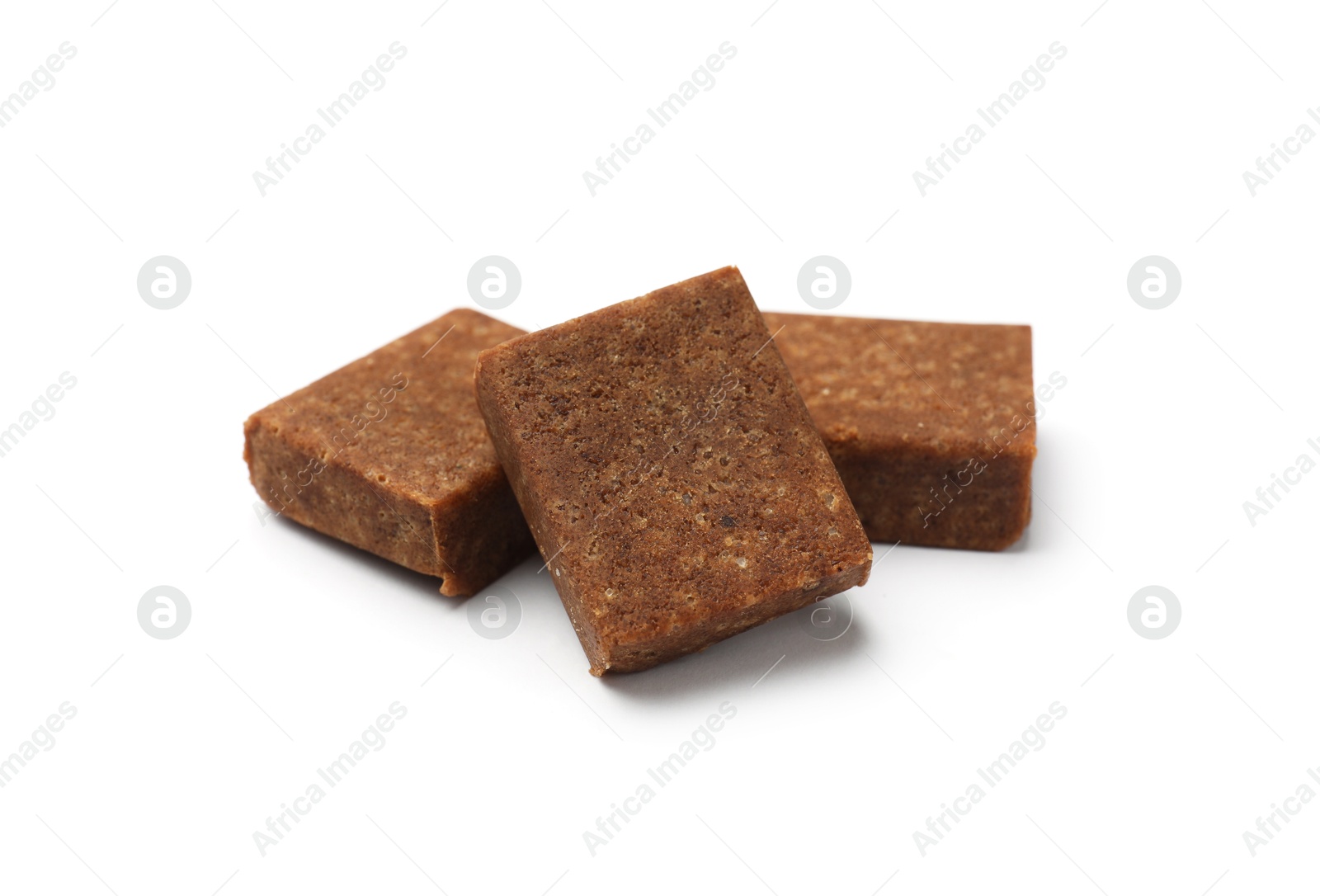 Three aromatic bouillon cubes isolated on white Photo of Three aromatic bouillon cubes isolated on white